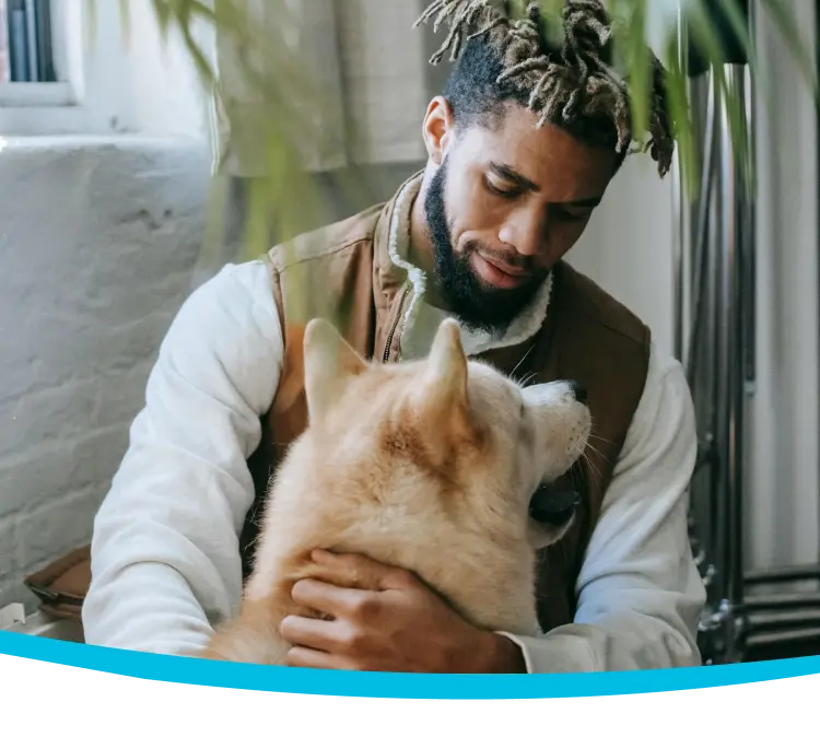 A man looks at his dog