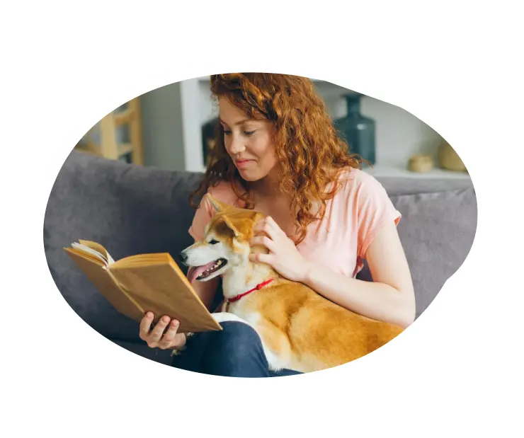 A pet sitter taking care of a happy dog